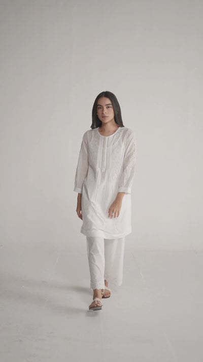 Woman wearing a white embroidered outfit on a plain background, White Mul Mul Co-ord Set for Women | Rangmanch | Ganga Fashions